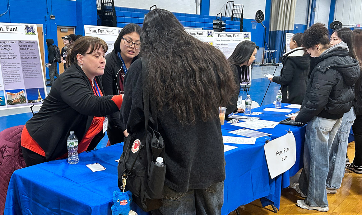 Credit for Life volunteers helped students make important financial decisions based on their given salaries. In addition to considering transportation, housing and food costs, students needed to budget for their hobbies at the “Fun, Fun, Fun” table.  