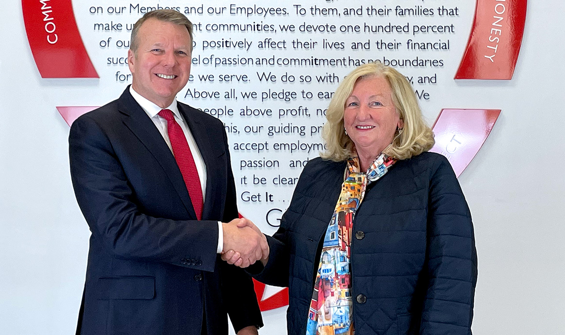 MVCU President & CEO John J. Howard and CBCU Manager Marta Carney at MVCU’s Lawrence corporate office. 