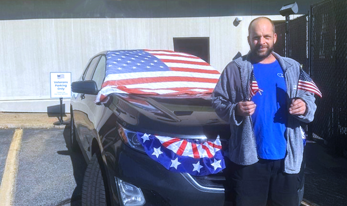 MVCU’s Facilities Manager Shaun Waeger with the 2018 Chevy Equinox that was donated to Vehicles for Veterans.