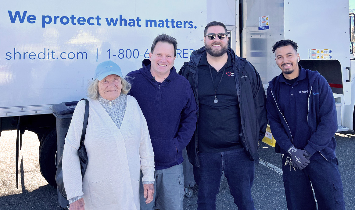 Fairhaven community members smile alongside MVCU’s South Regional Sales & Service Manager Jimmy Kruskall (third from left) as they dropped off documents for shredding. 